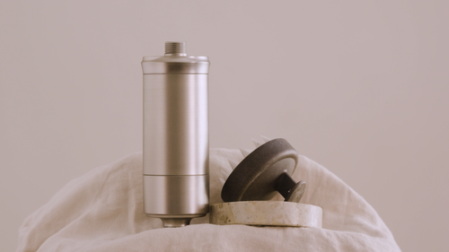 The SEDA shower filter stands next to other hair products.